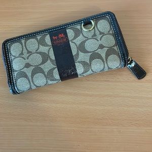 Authentic Coach wallet- not outlet. Monogram coated canvas.